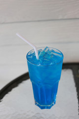 Ice Blue Hawaii in glass on table.