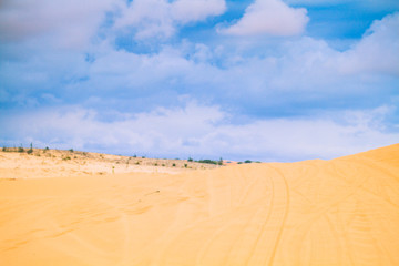 White Desert At Mui Ne / Sunny Day With Blue Sky And Clouds On Sand Dune White Desert At Mui Ne Vietnam.