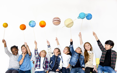 Group of Kids Holding Papercraft Galaxy Symbol on White Blackground