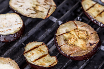Fresh grilled summer eggplant aubergine on a bbq barbecue grill