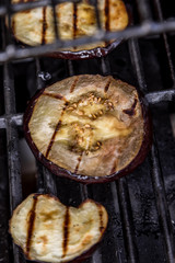 Fresh grilled summer eggplant aubergine on a bbq barbecue grill