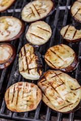 Fresh grilled summer eggplant aubergine on a bbq barbecue grill