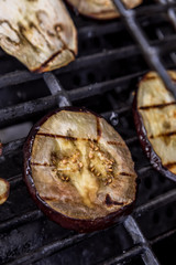 Fresh grilled summer eggplant aubergine on a bbq barbecue grill
