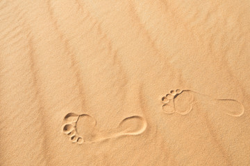 Fototapeta na wymiar Foot prints in the sand.