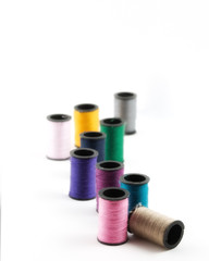 Spools of thread on white background