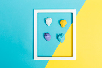 Painted strawberries and frame on split background
