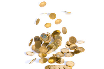 Falling gold coins. Money on a white background. shallow focus.