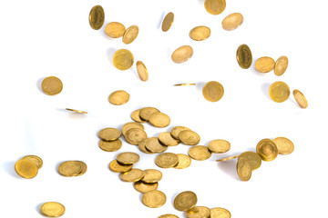 Falling gold coins. Money on a white background. shallow focus.