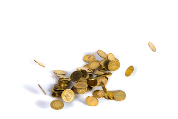 Falling gold coins. Money on a white background. shallow focus.