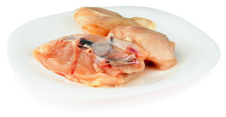 Fresh filleted chicken on plate