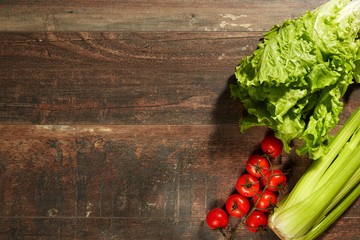 Healthy Food & drink diet Italian lifestyle: Mediterranean fruits vegetables herbs spices. Top view. Wooden rustic background. Free space text layout