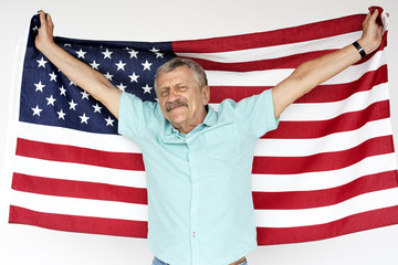 Senior adult man holding american flag