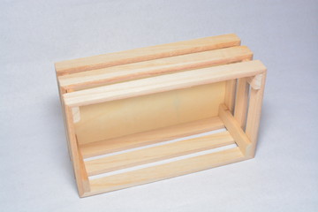 miniature of wooden pallet or box. Isolated on white background. (visible slightly soft focus).