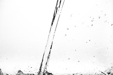 Splashes of water on a white background. Water jet