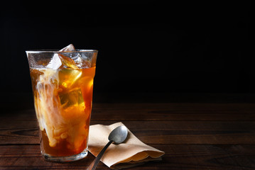 Iced Coffee on Wood Table With Spoon