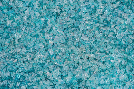 Background of decorative broken bits of blue color glass
