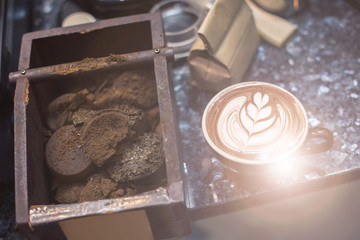 a cup of latte coffee on the table