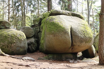 Fototapeta na wymiar Rock structure Ďáblova prdel Devil´s ass in forest near Horni Meziricko, Czech republic