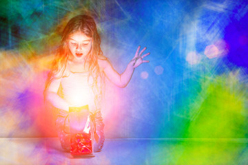 Girl looks in a red glowing gift bag on a colorful background