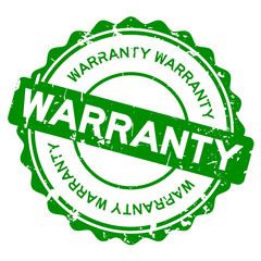 Grunge green warranty round rubber seal stamp on white background