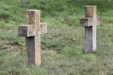 Two old nameless crosses in the military cemetery