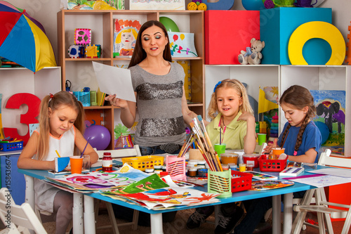 "Kids playroom organization of children painting and drawing in kid's