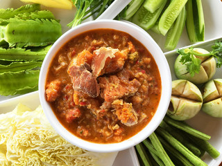 Egg Crab chili dip sauce with vegetable. A dip or dipping sauce is a common condiment for many types of food