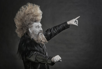 Portrait of a cheerful man with long hair and beard