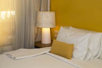 Pillows on bed and lamp