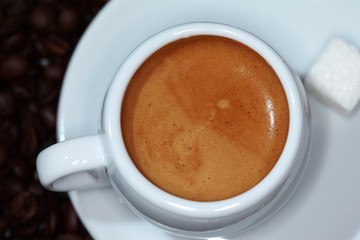 cup of coffee on the background of coffee beans