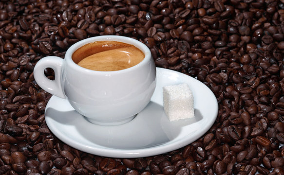 cup of coffee on the background of coffee beans