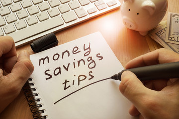 Money saving tips written in a note.