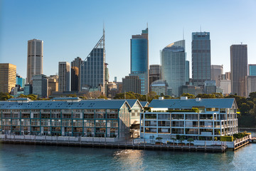 Fototapeta premium Historic Woolloomooloo wharf with Sydney CBD skyscrapers on the background