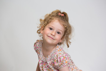 Studio Portrait of a sweet Little girl kidding around