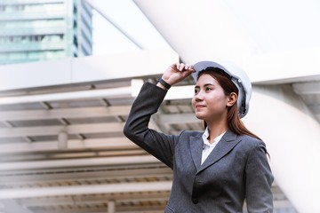 Muslim engineer woman is standing in the city