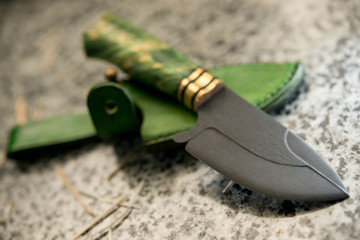 small pocket knife, and a leather sheath