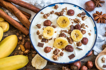 Serving of White Yogurt with  Muesli, Banana and Nuts