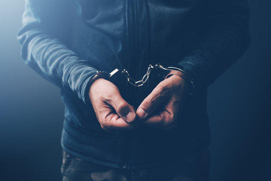 Arrested Computer Hacker With Handcuffs