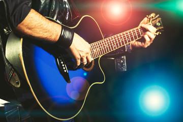 Fototapeta na wymiar Guitar player during a show