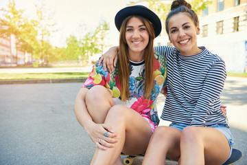 Two cheerful friendly confident young women