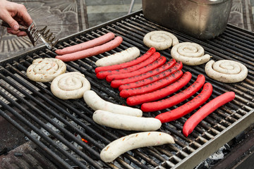 Closeup shot of the sausages on a grill