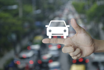 Car flat icon on finger over blur of rush hour with cars and road, Business service car concept