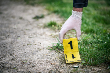 Crime scene investigation, placing the crime scene marker on the ground