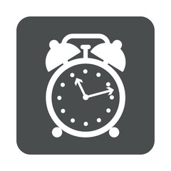 Icono plano despertador en cuadrado gris