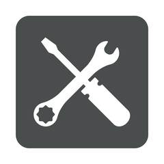 Icono plano destornillador y llave en cuadrado gris
