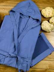 blue microfibre bathrobe on wood flooring