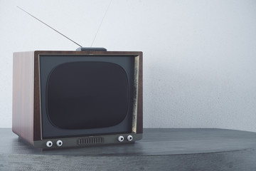 Vintage TV on concrete background