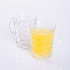 Orange juice in glasses on white background.