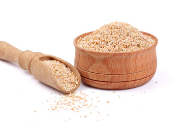 wheat porridge in wooden bowl isolated on white background