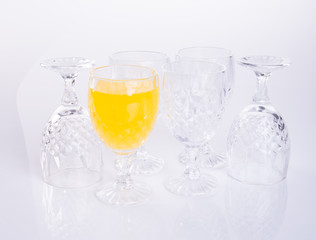 Orange juice in glasses on white background.